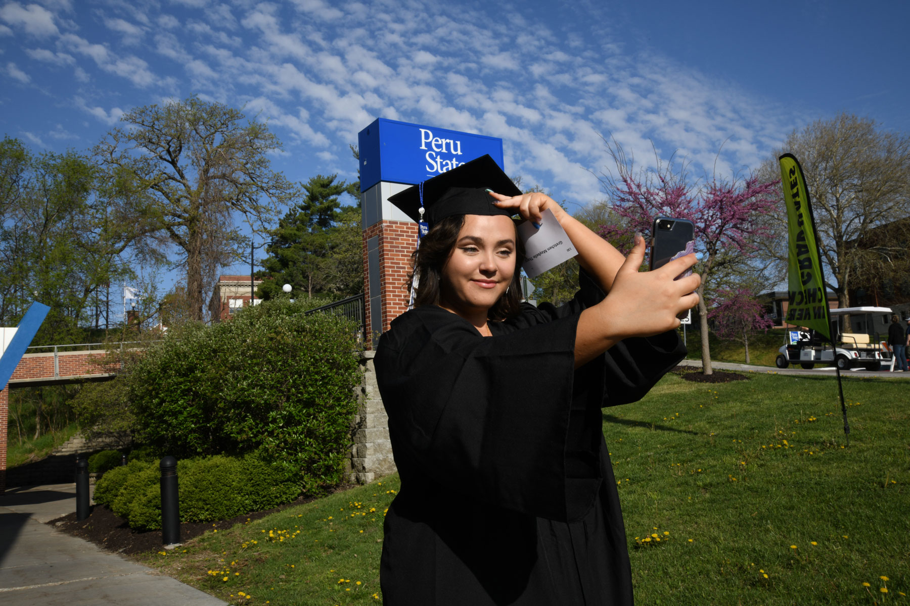 female student in cap and gown