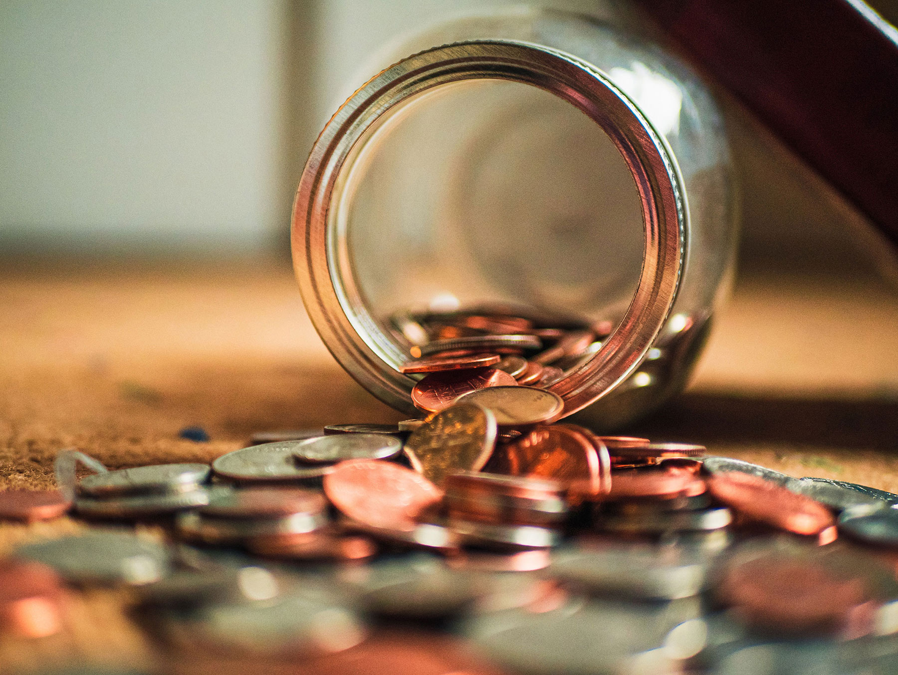 glass jar with coins