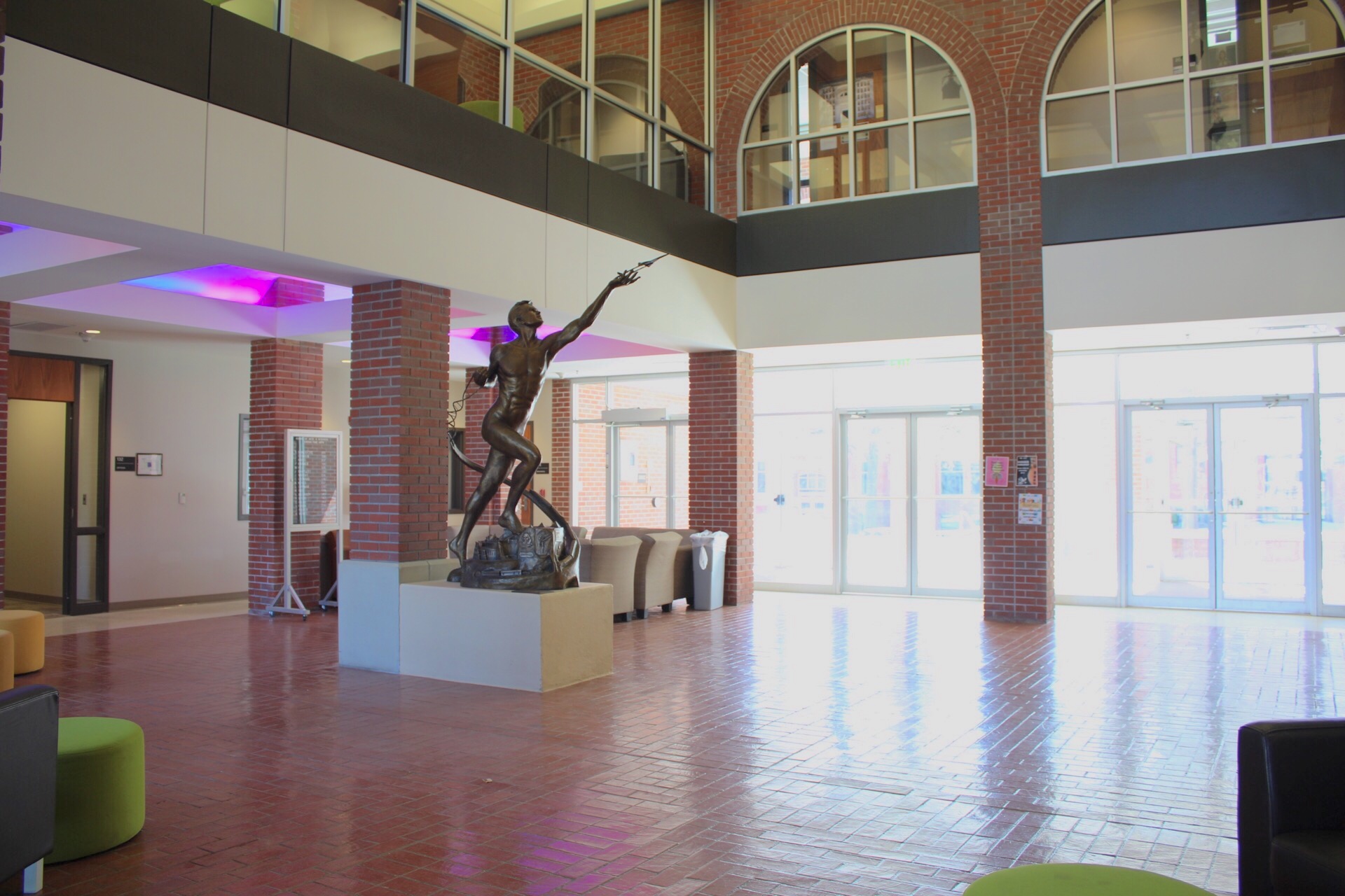 Jindra Lobby with brick floor and pillars, The Power of Thought sculpture and seating areas