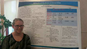 Paige Meyer with the poster she presented at the conference.