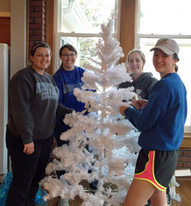 Emily Whipple, Jessica Weickert, Marisa Pribnow and Lindsay Harlow help decorate the President's House.