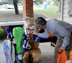 Dan Hanson, president of Peru State College, shows Gideon Hogue there's nothing to fear from this bobcat!