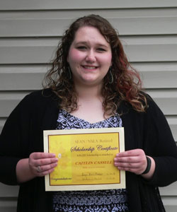 Caitlin Cassel posing with her certificate of achievement for recipients of the Associations 2017 scholarships. The Peru State College student received a $1000 scholarship for her student teaching semester next year.