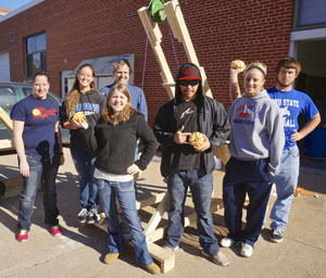 Paul Hinrichs with a physic class that designed trebuchets.