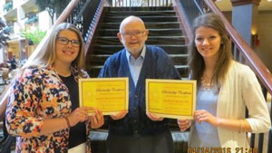 Scholarship Recipients: NSEA-Retired Vice President Tom Black, center, Mariah Bigelow, right, and University of Nebraska's Haley Montgomery, left.