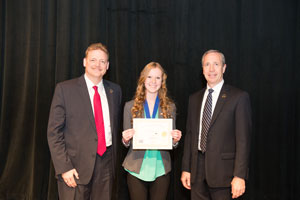 First Place, Senior Individual Exhibit, Katelyn Nielson with Todd Simpson, Executive Director of the Peru State College Foundation (left) and Dr. Dan Hanson, President of Peru State College (right).