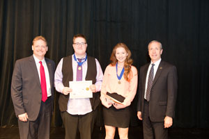 First Place, Senior Group Exhibit, Maddie Werner and Anna Bohlken with Todd Simpson, Executive Director of the Peru State College Foundation (left) and Dr. Dan Hanson, President of Peru State College (right).