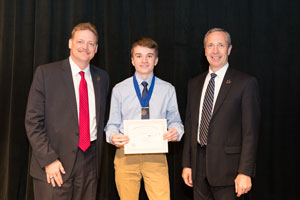 First Place Senior Individual Interpretive Website, Oliver Borchers-Williams with Executive Director of the Peru State College Foundation, Todd Simpson (left) and President of Peru State College, Dr. Dan Hanson (right).