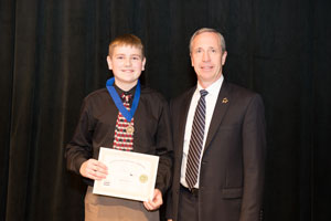 First Place in Junior Individual Historical Paper, Ethan Roberts with President of Peru State College, Dr. Dan Hanson