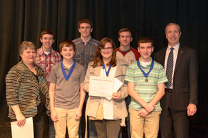 On behalf of the Nemaha Valley Museum, Maxine Schatz (far left) presents cash awards to students from Johnson-Brock and St. John the Baptist with Dr. Dan Hanson, President of Peru State College (far right)