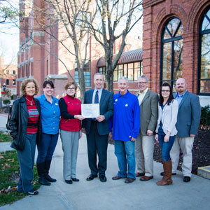  Dr. Sara Crook, Nebraska State Sesquicentennial Committee Chair, presented a certificate to the college's sesquicentennial committee. From left to right: Amy Mincer, Deborah Solie, Dr. Sara Crook, Dr. Dan Hanson, Ted Harshbarger, Dr. Dan Holtz, Kelly Kole and Jason Hogue.