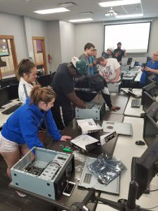 Students working on desktop computers.