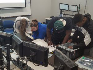 Students working on desktop computers.