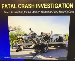 Fatal Crash Investigation slide showing a crumpled vehicle on a flatbed truck.