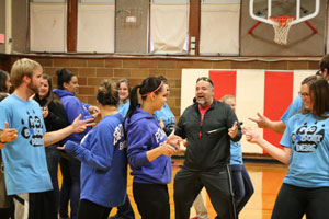 Assistant Professor of Education, Dr. Frank Lynott, leads Peru State School of Education Students in warm-up activities before the HTRS students arrive.
