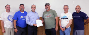 Mayor Reeves presenting the June 20 proclamation to President Hanson (center) with (left to right) Council Members Brent Melvin, Mark Mathews, Dave Pease and Jason Jones.