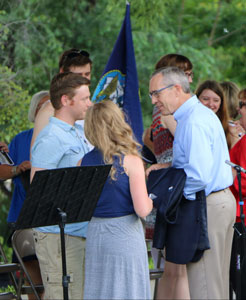 President Hanson speaks with cast members of the Brownville Village Theatre.