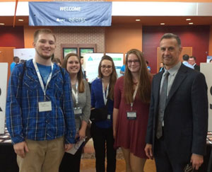 Students with keynote speaker at InfoTec conference.