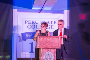 Dr. Sara Crook and Dr. Dan Holtz asked the crowd Peru State trivia questions.