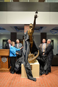 Victor Issa, Peggy Long, Daryl Long, Todd Simpson and Dan Hanson unveiling the statue.