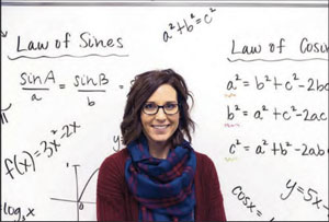 Braxmeyer appears before a white board of math equations.