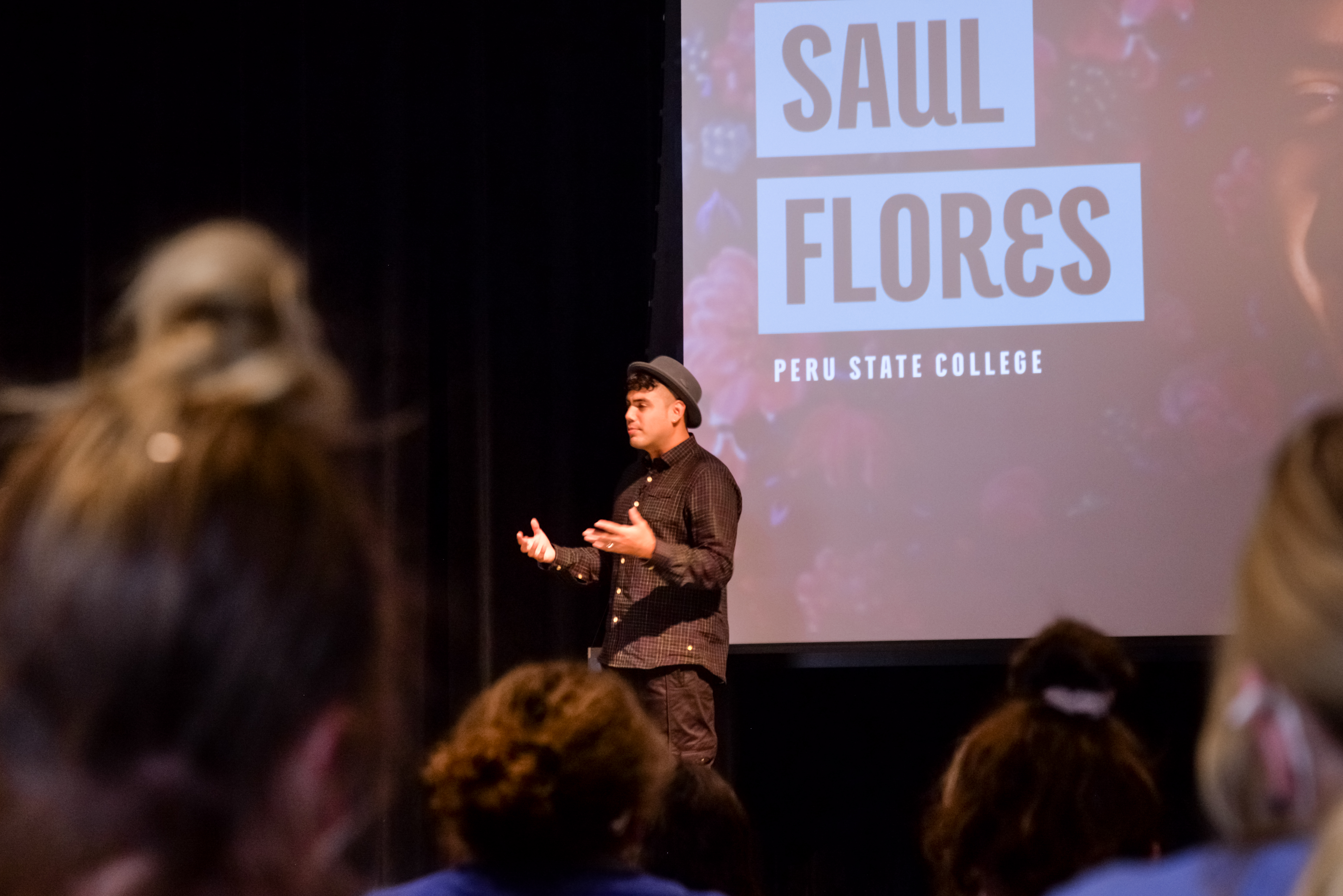 Saul Flores presents in the Performing Arts Center