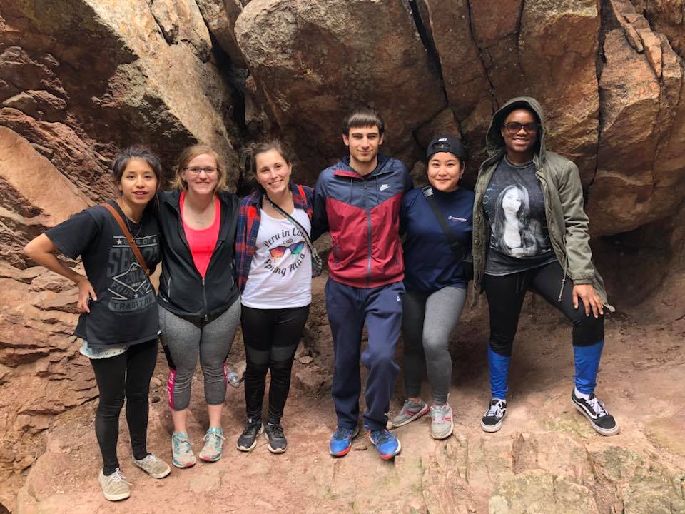 Students exploring a cave